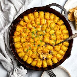 Cowboy Casserole aerial in skillet with spoon.