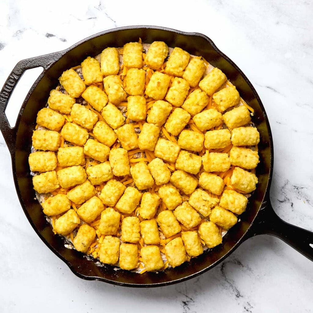 Cowboy tater tot casserole ready for oven.