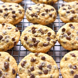 Whole Wheat Chocolate Chip Cookies lined up on cooling rack.