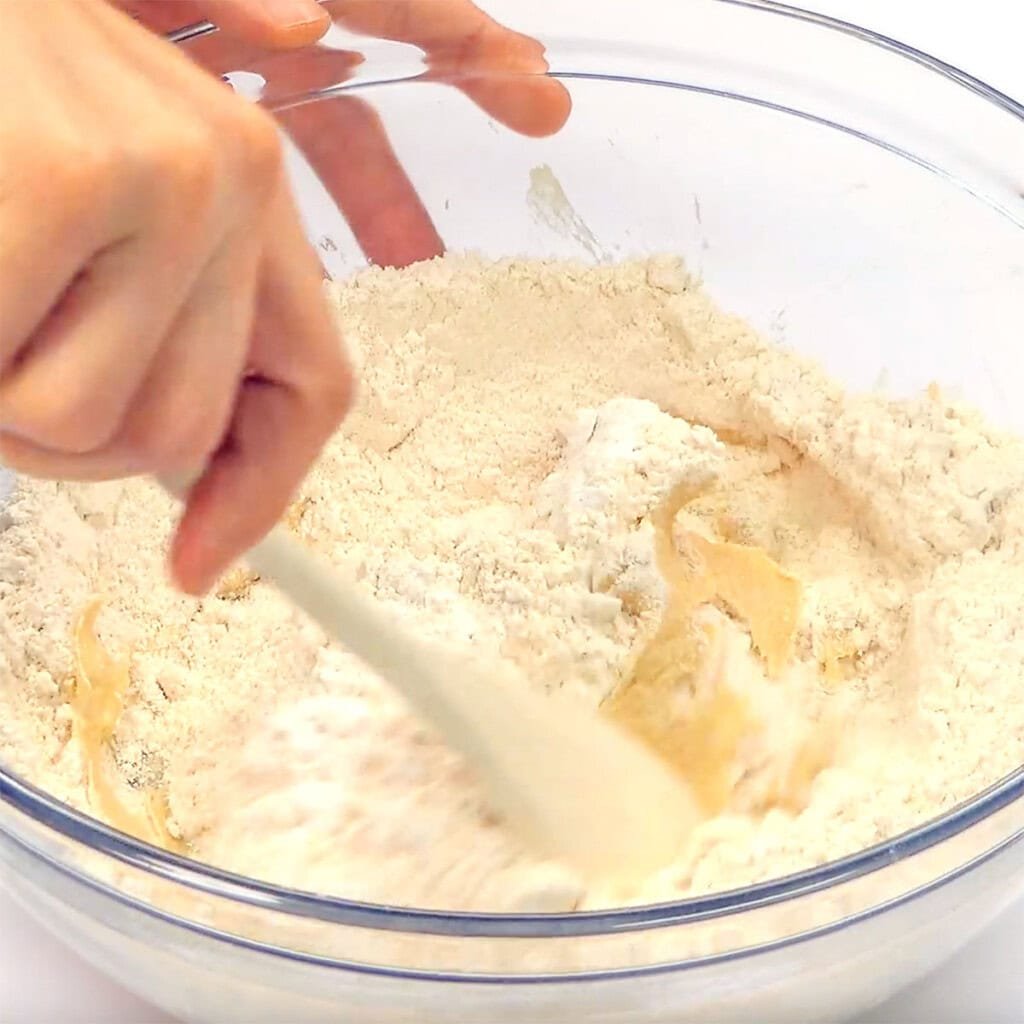 Blending flour into Whole Wheat Chocolate Chip Cookie recipe.